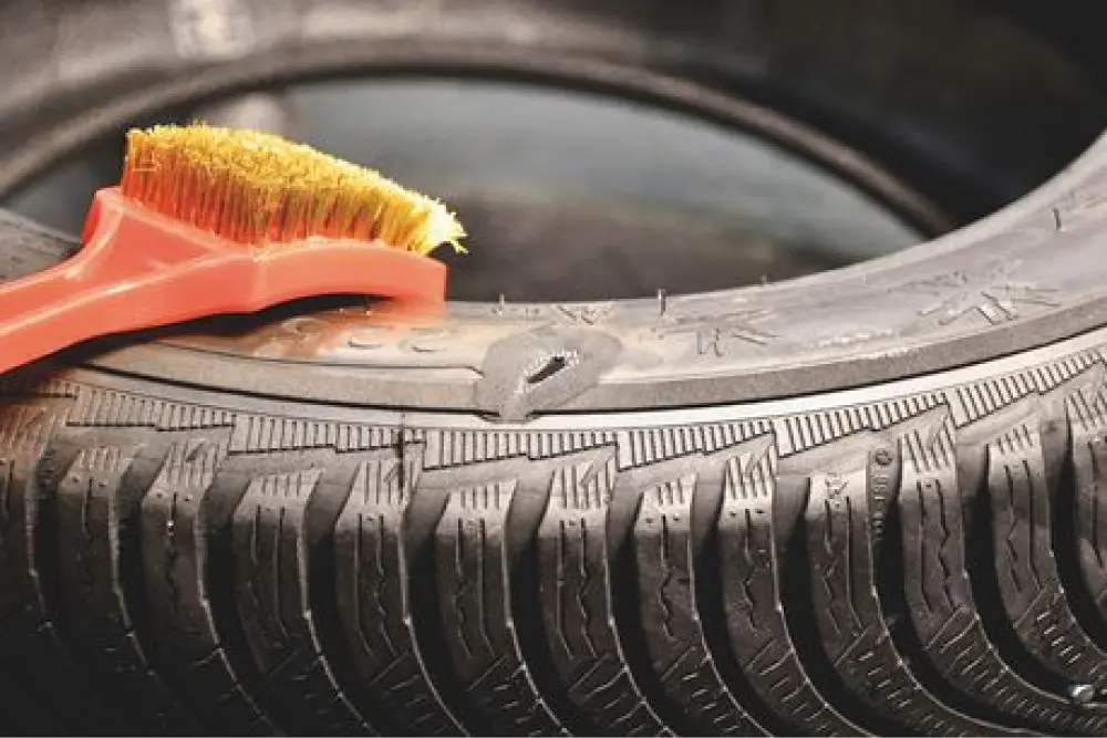 Close-up of a rubber tire with a hole that needs to be repaired